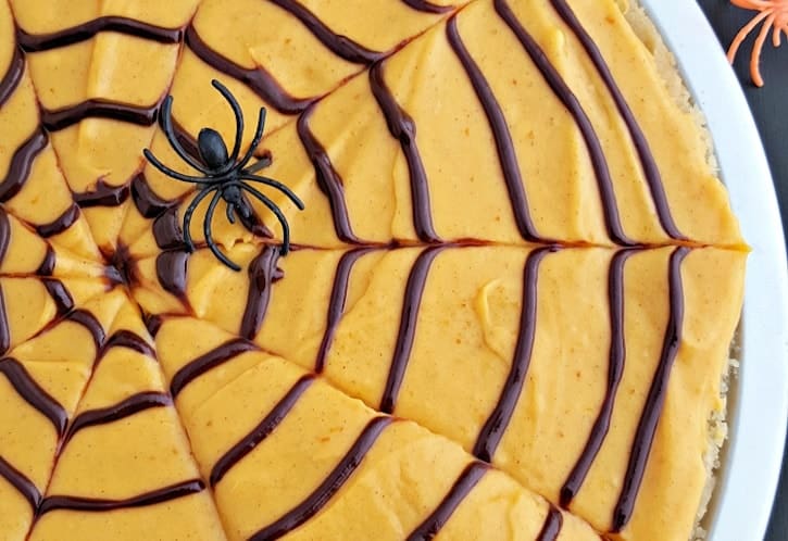 Spooky Pumpkin-Spiced Cookie Pizza with a Spiderweb Twist