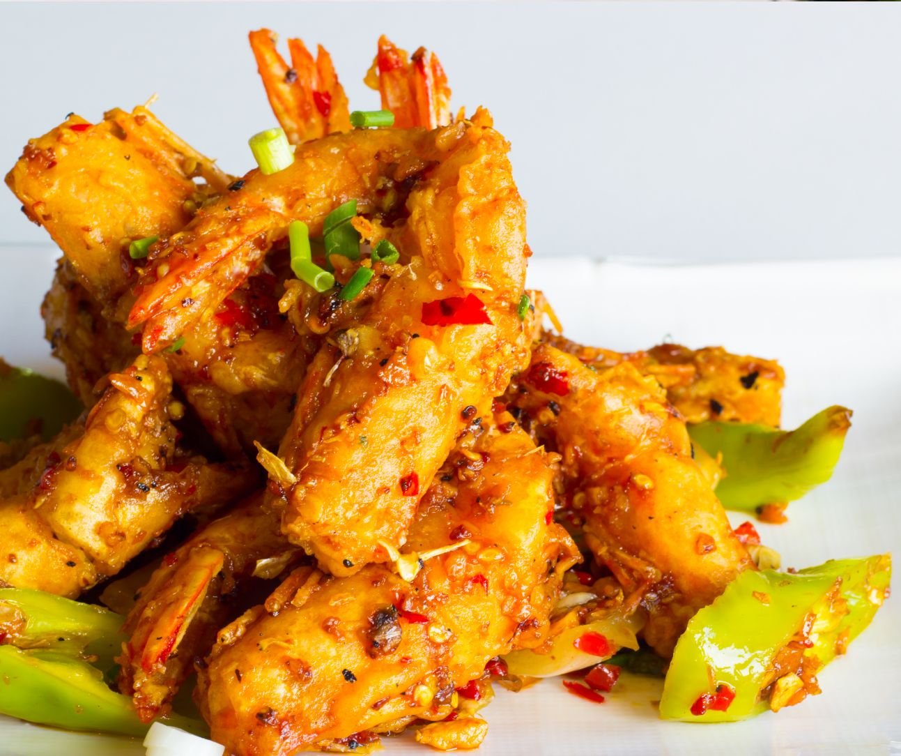 Golden Crispy Shrimp with Sautéed Peppers and Onions