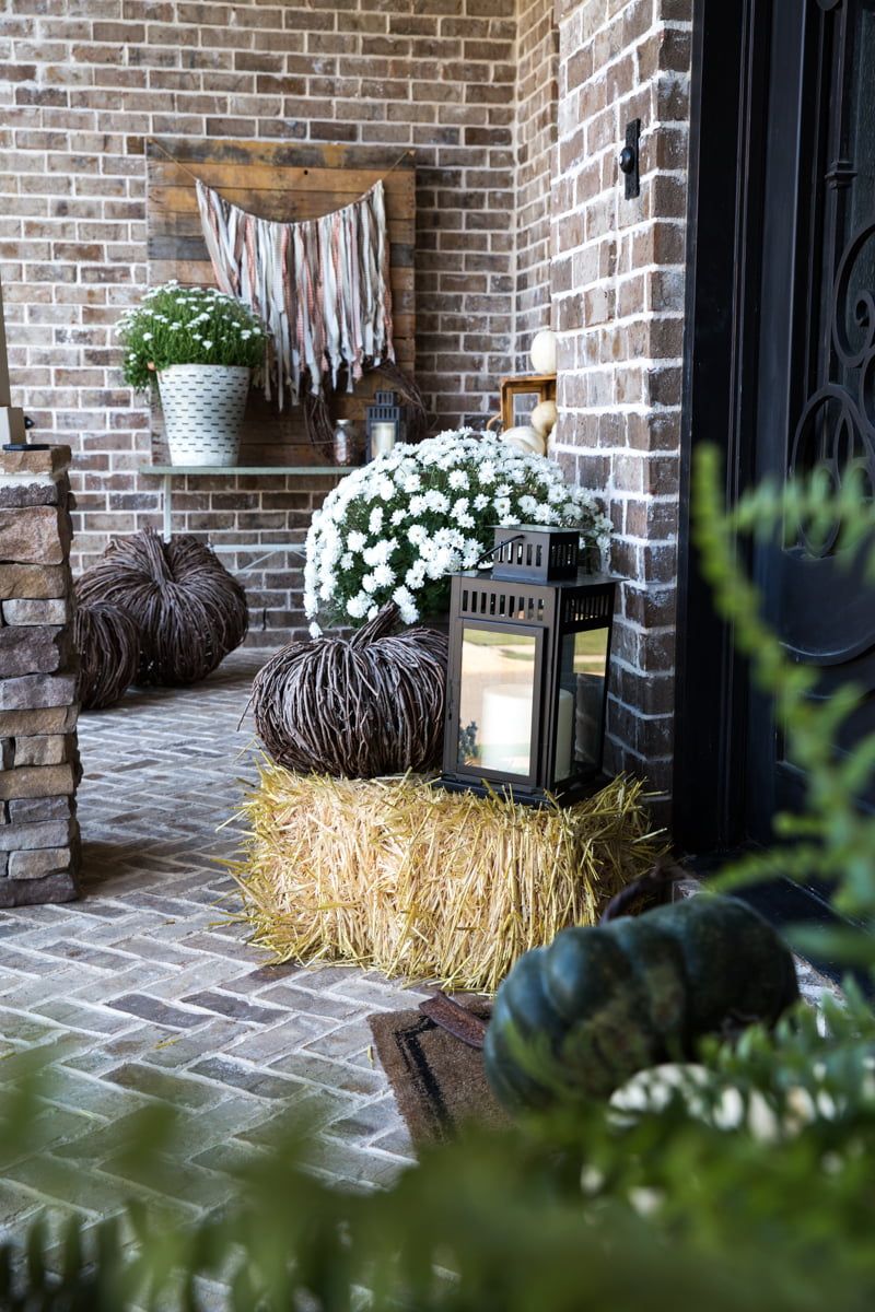 Autumn Anchor: Layered Hay Bale Porch Decor