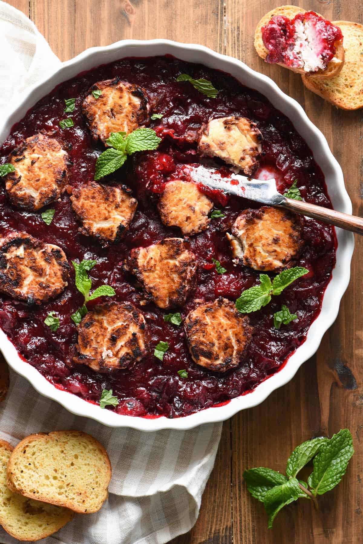 Cranberry-Glazed Baked Goat Cheese Crostini